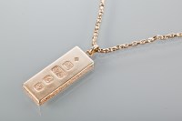 Lot 1780 - NINE CARAT GOLD INGOT MOTIF PENDANT fully...