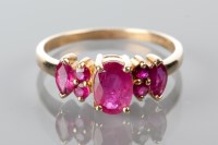 Lot 1784 - RUBY FIVE STONE DRESS RING set with oval,...