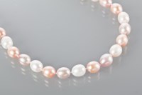 Lot 1800 - FRESHWATER PEARL NECKLACE formed by ovoid...