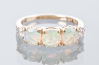 Lot 1802 - OPAL THREE STONE RING set with three round...