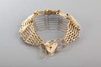 Lot 1837 - NINE CARAT GOLD GATE BRACELET with padlock...