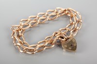 Lot 1838 - NINE CARAT ROSE GOLD BRACELET with a double...