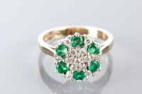 Lot 1843 - EMERALD AND DIAMOND CLUSTER RING the round...