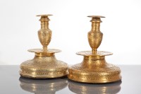 Lot 319 - PAIR OF MIDDLE EASTERN BRASS CANDLESTICKS with...