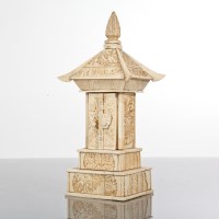 Lot 332 - CHINESE IVORY SHRINE with two doors opening to...