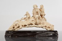 Lot 333 - CHINESE IVORY CARVING of two figures and a...