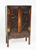 Lot 348 - CHINESE HARDWOOD CUPBOARD the two doors with...