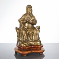 Lot 392 - CHINESE BRONZE DEITY ON STAND the figure...