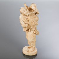 Lot 405 - JAPANESE IVORY OKIMONO of a male with child on...