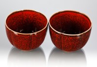 Lot 420 - PAIR OF CHINESE TEA BOWLS in red and black and...