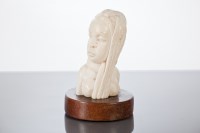 Lot 283 - AFRICAN IVORY BUST OF A FEMALE shown with long...
