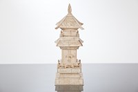 Lot 357 - CHINESE IVORY SHRINE with doors opening to...