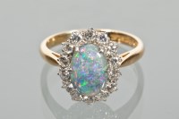 Lot 1628 - BLACK OPAL AND DIAMOND CLUSTER RING the oval...