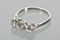 Lot 1632 - DIAMOND THREE STONE RING the brilliant cut...