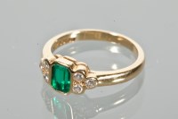Lot 1638 - EMERALD AND DIAMOND RING set with a central...
