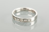 Lot 1652 - DIAMOND SET WEDDING BAND set with eight...