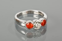 Lot 1663 - DIAMOND AND FIRE OPAL THREE STONE RING the...