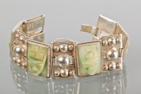 Lot 1690 - UNUSUAL MEXICAN SILVER BRACELET set with green...