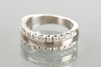 Lot 1698 - DIAMOND SET BAND with two rows of brilliant...