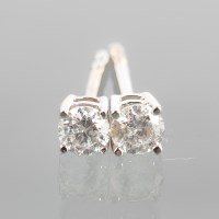 Lot 1706 - PAIR OF DIAMOND STUD EARRINGS each set with a...