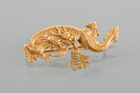 Lot 1712 - CHINESE GOLD BROOCH in the form of a dragon...