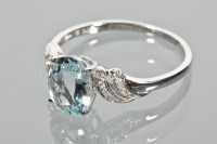Lot 1713 - AQUAMARINE DRESS RING set with an oval...