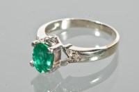 Lot 1714 - EMERALD AND DIAMOND RING set with an oval...