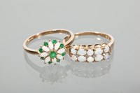 Lot 1721 - TWO OPAL DRESS RINGS one set with opals and...