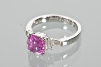 Lot 1726 - PINK SAPPHIRE AND DIAMOND RING the pink...