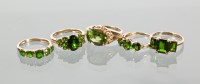 Lot 1731 - FIVE GOLD GEM SET RINGS each set with green...