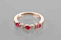 Lot 1754 - RUBY AND DIAMOND RING set with alternating...