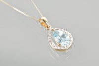 Lot 1762 - AQUAMARINE AND DIAMOND PENDANT with a pear cut...