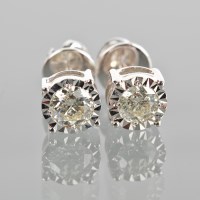 Lot 1765 - PAIR OF DIAMOND STUD EARRINGS the illusion set...