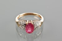 Lot 1767 - RUBY AND DIAMOND RING with a central oval ruby...
