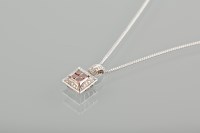 Lot 1789 - RED AND WHITE DIAMOND PENDANT set with four...