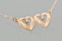 Lot 1797 - FOURTEEN CARAT GOLD NECKLET formed by two...