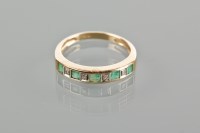 Lot 1823 - EMERALD AND DIAMOND HALF ETERNITY RING set...