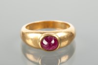 Lot 1831 - LATE TWENTIETH CENTURY RUBY RING set with a...