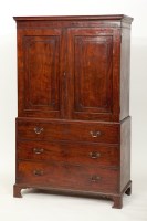 Lot 768 - GEORGE III MAHOGANY LINEN PRESS the top doors...