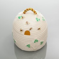 Lot 522 - BELLEEK BEE-HIVE PRESERVE JAR AND COVER, the...