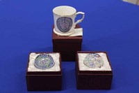 Lot 569 - TWO GLASS PAPERWEIGHTS AND A CERAMIC MUG, the '...