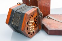 Lot 736 - VICTORIAN WALNUT CONCERTINA with fretted ends,...