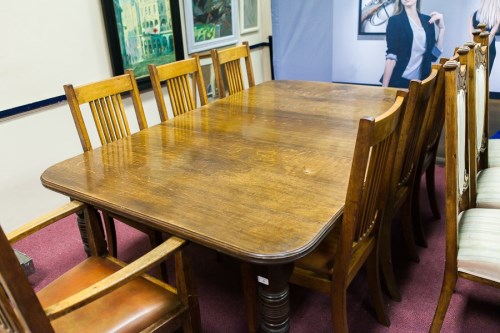 Lot 981 - VICTORIAN OAK EXTENDING DINING TABLE with one...