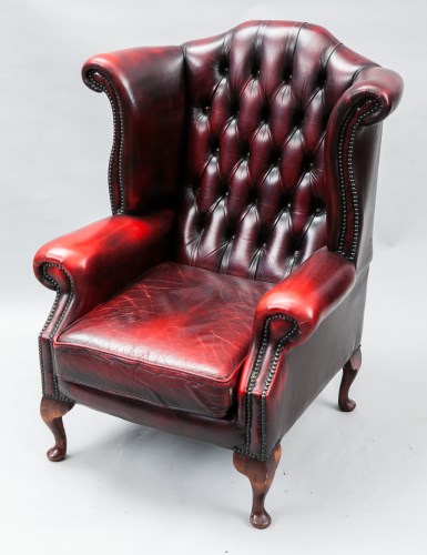 Lot 1035 - OXBLOOD BUTTON BACK THREE SEAT CHESTERFIELD...