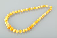 Lot 1634 - AMBER BEAD NECKLACE with graduated yellow...