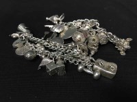 Lot 8 - TWO ATTRACTIVE SILVER CHARM BRACELETS...