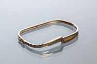 Lot 1988 - NINE CARAT GOLD BI COLOUR BANGLE of geometric...