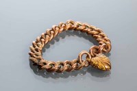 Lot 1990 - NINE CARAT GOLD CURB LINK BRACELET with...