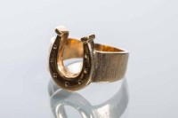 Lot 2003 - GENTLEMAN'S NINE CARAT GOLD HORSESHOE RING...