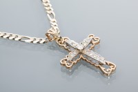Lot 2005 - NINE CARAT GOLD AND CZ CROSS PENDANT set with...